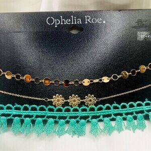 set from Ophelia Roe. features three distinct pieces choker necklaces